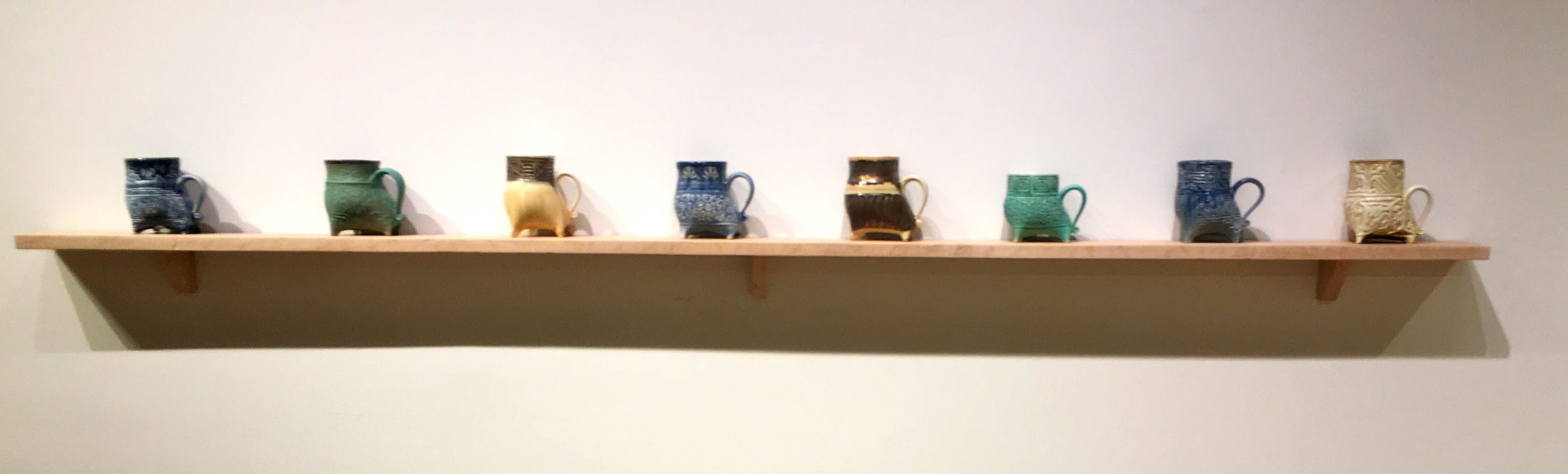 mugs on a shelf.jpg